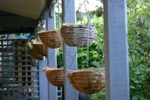 Tiered hanging baskets make use of vertical space